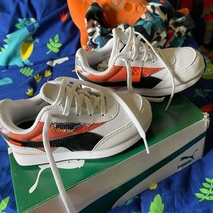 Pumas size 13. White, with black and orange design.
